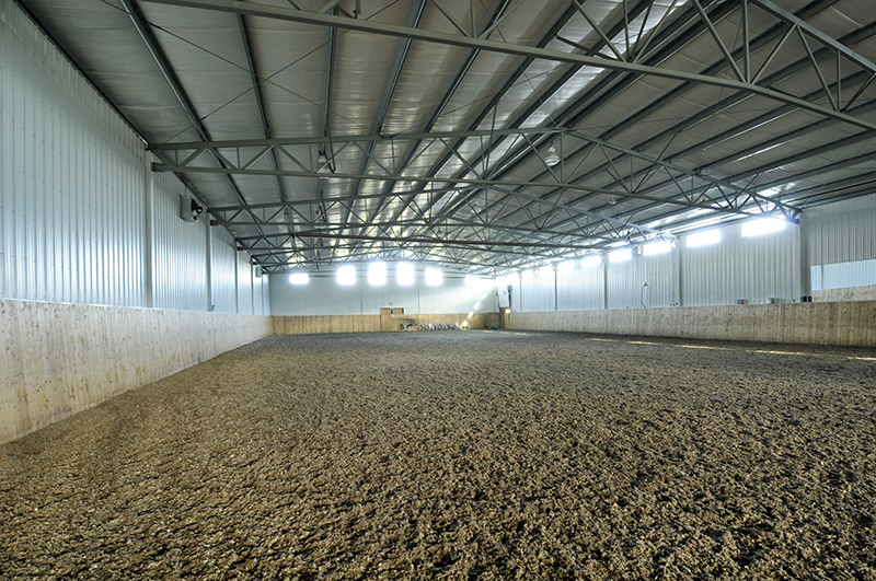 horse riding arena, indoor horse riding arenas, building horse riding arena, we cover, dutchmasters, ironwood building systems, fabric covered horse riding arena, wood post frame horse riding arena, lindsay day remt, steel frame horse riding arena, pre-engineered horse riding arenas, pre-built horse riding arenas, horse arena footing, pdi lasergrade, horse riding arena permit