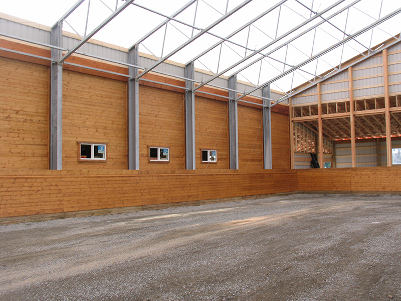horse riding arena, indoor horse riding arenas, building horse riding arena, we cover, dutchmasters, ironwood building systems, fabric covered horse riding arena, wood post frame horse riding arena, lindsay day remt, steel frame horse riding arena, pre-engineered horse riding arenas, pre-built horse riding arenas, horse arena footing, pdi lasergrade, horse riding arena permit