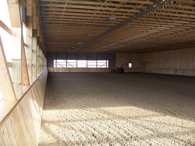 horse riding arena, indoor horse riding arenas, building horse riding arena, we cover, dutchmasters, ironwood building systems, fabric covered horse riding arena, wood post frame horse riding arena, lindsay day remt, steel frame horse riding arena, pre-engineered horse riding arenas, pre-built horse riding arenas, horse arena footing, pdi lasergrade, horse riding arena permit