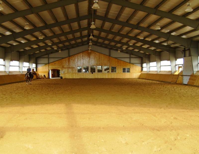 horse riding arena, indoor horse riding arenas, building horse riding arena, we cover, dutchmasters, ironwood building systems, fabric covered horse riding arena, wood post frame horse riding arena, lindsay day remt, steel frame horse riding arena, pre-engineered horse riding arenas, pre-built horse riding arenas, horse arena footing, pdi lasergrade, horse riding arena permit