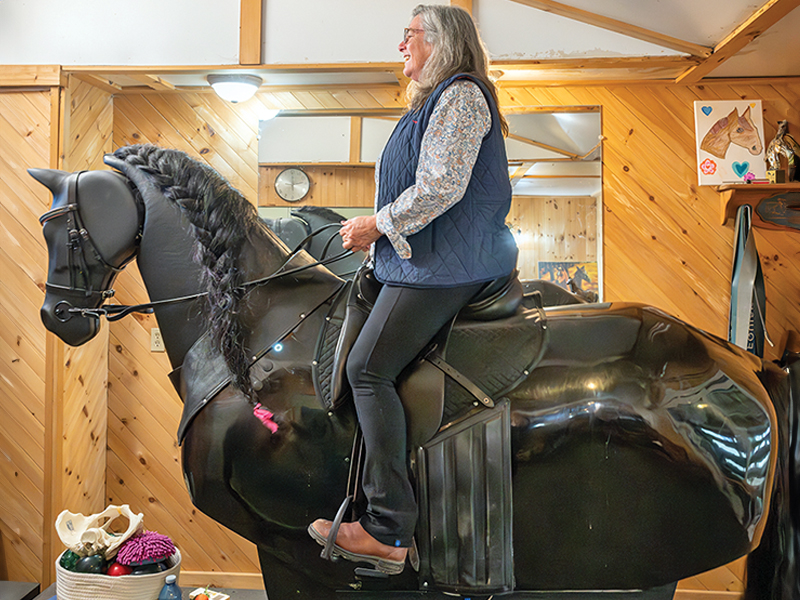 Rider training on RooElla horse simulator to maintain fitness, balance, and correct riding posture.