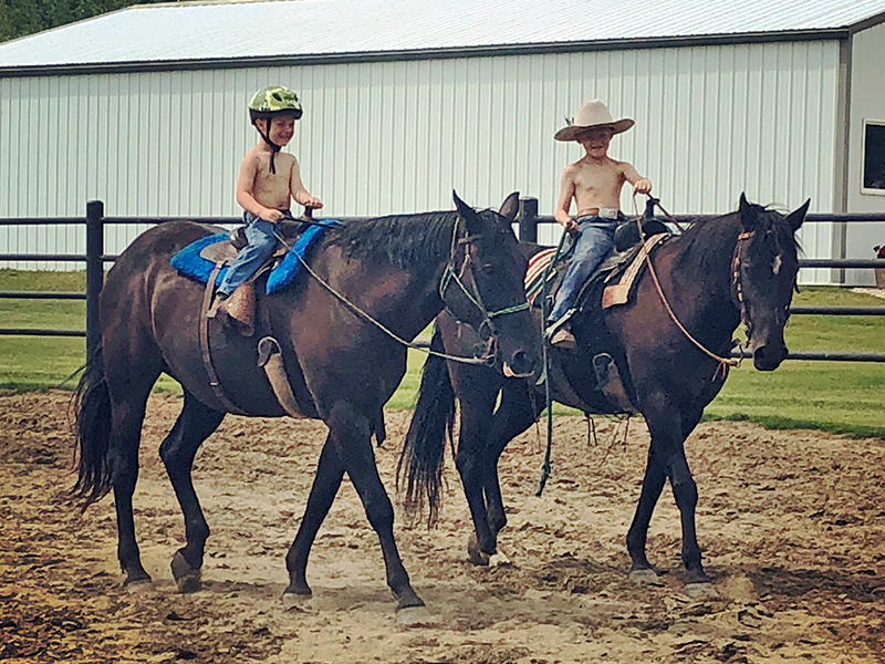 Children enjoying horseback riding and inspiring a lifelong love of horses.